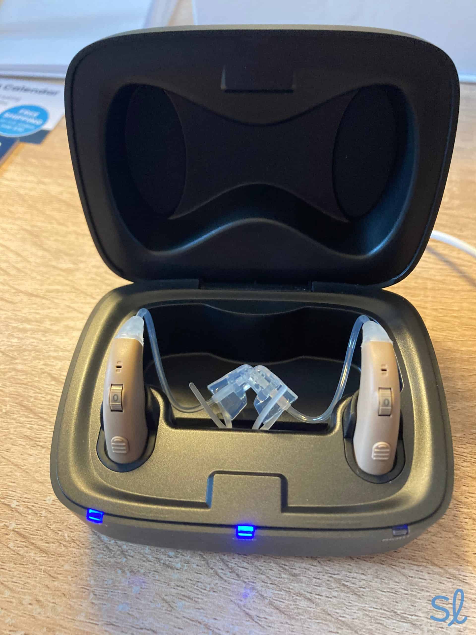 The MDHearing VOLT hearing aids are easy to charge, and a blue light indicates that they are charging_