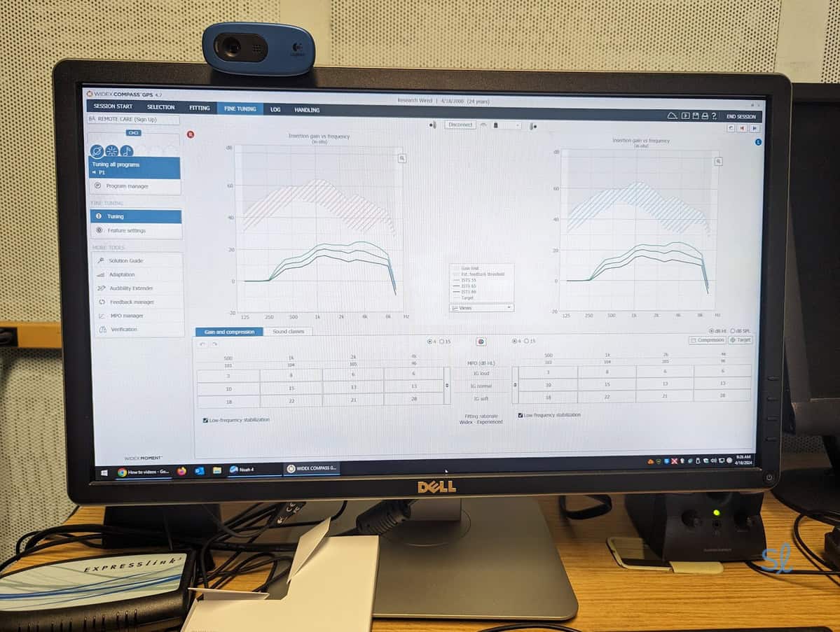 Dr. Reisman testing and customizing a pair of Widex Moment hearing aids